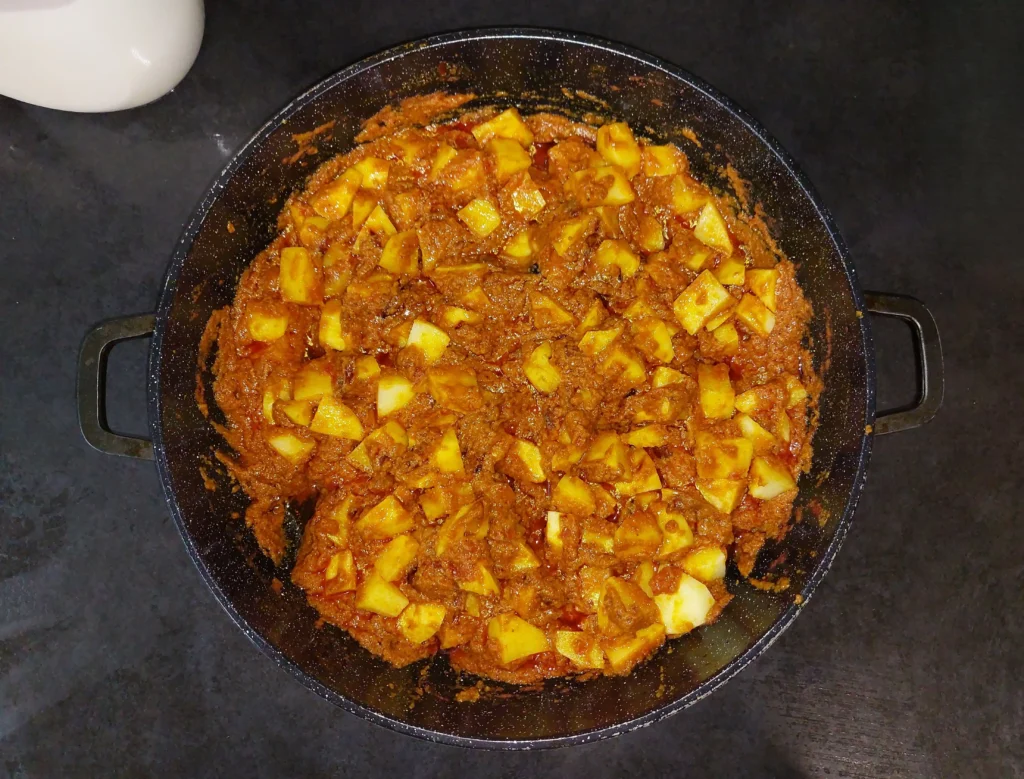 Drained potatoes mixed with masala