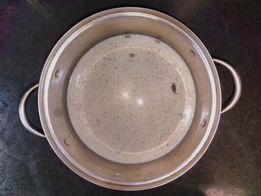 Adding milk, rosewater, and kewra water to the vermicelli