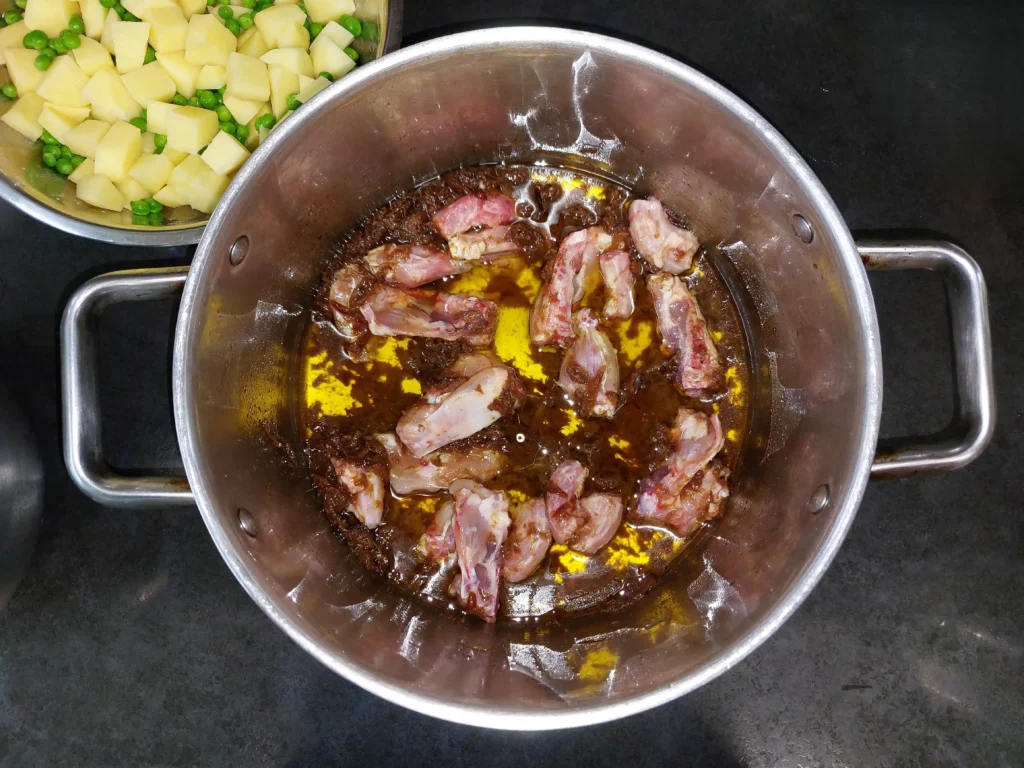 Adding chicken to the onions