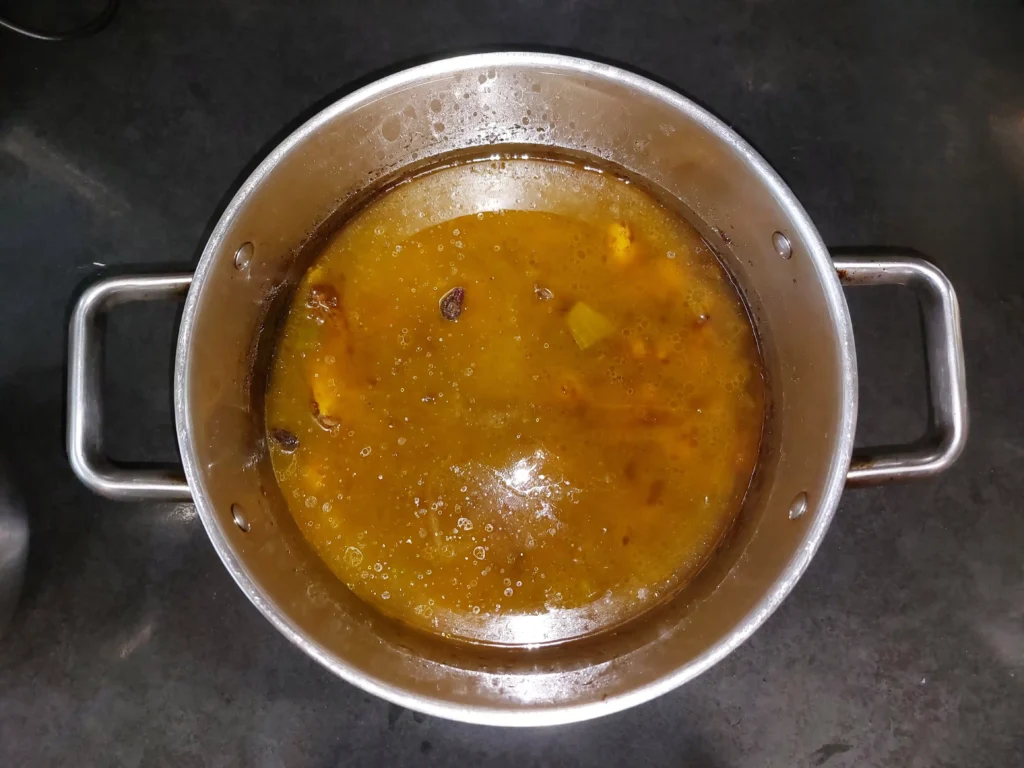 Adding water to boil the rice in