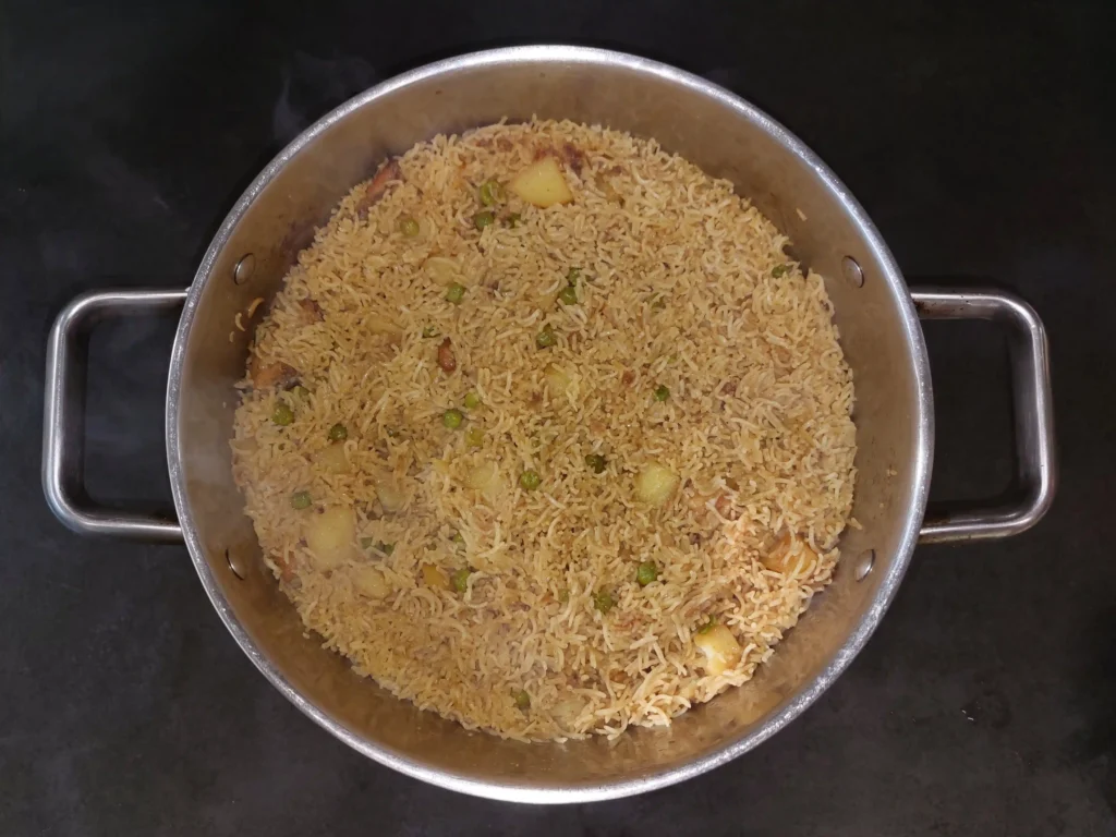 Chicken pulao has dried and is now ready