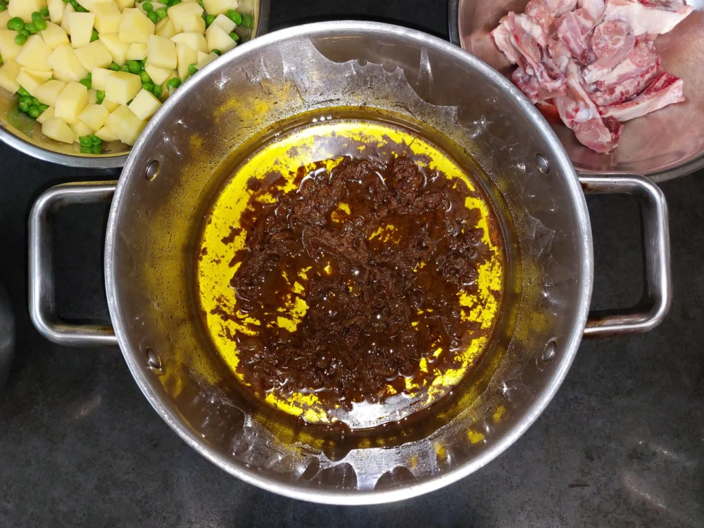 Mashed onion, ginger and spices to form base of chicken pulao